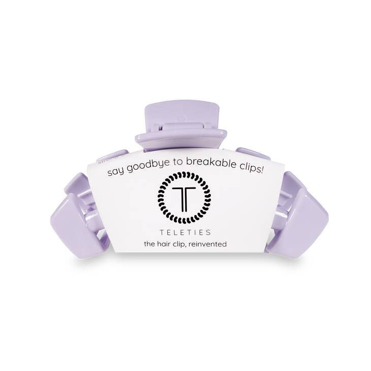 Medium hair clip with bendable teeth in a neutral tone designed for thick to medium-thickness hair.