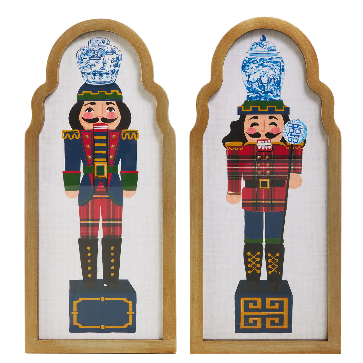 Two framed nutcracker wall art pieces with blue and white ginger jars on their heads.