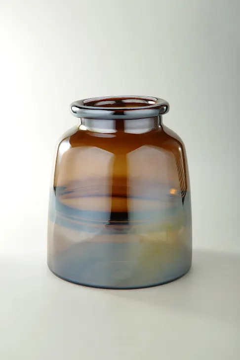 Brown glass vase with an octagonal shape measuring approximately nine point four inches tall.