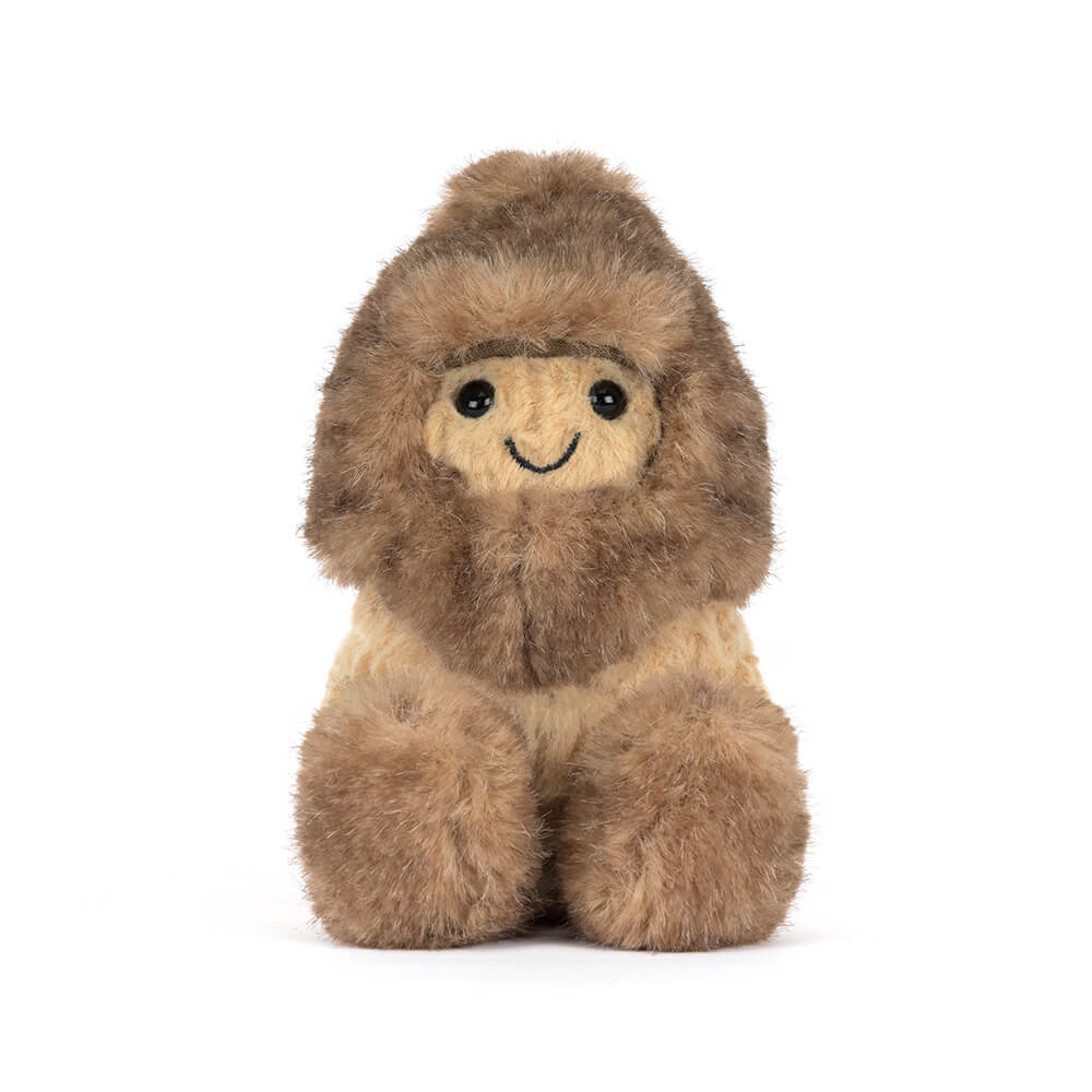 Amuseables Peanut plush toy wearing a fuzzy brown Yeti outfit with a smiling face.