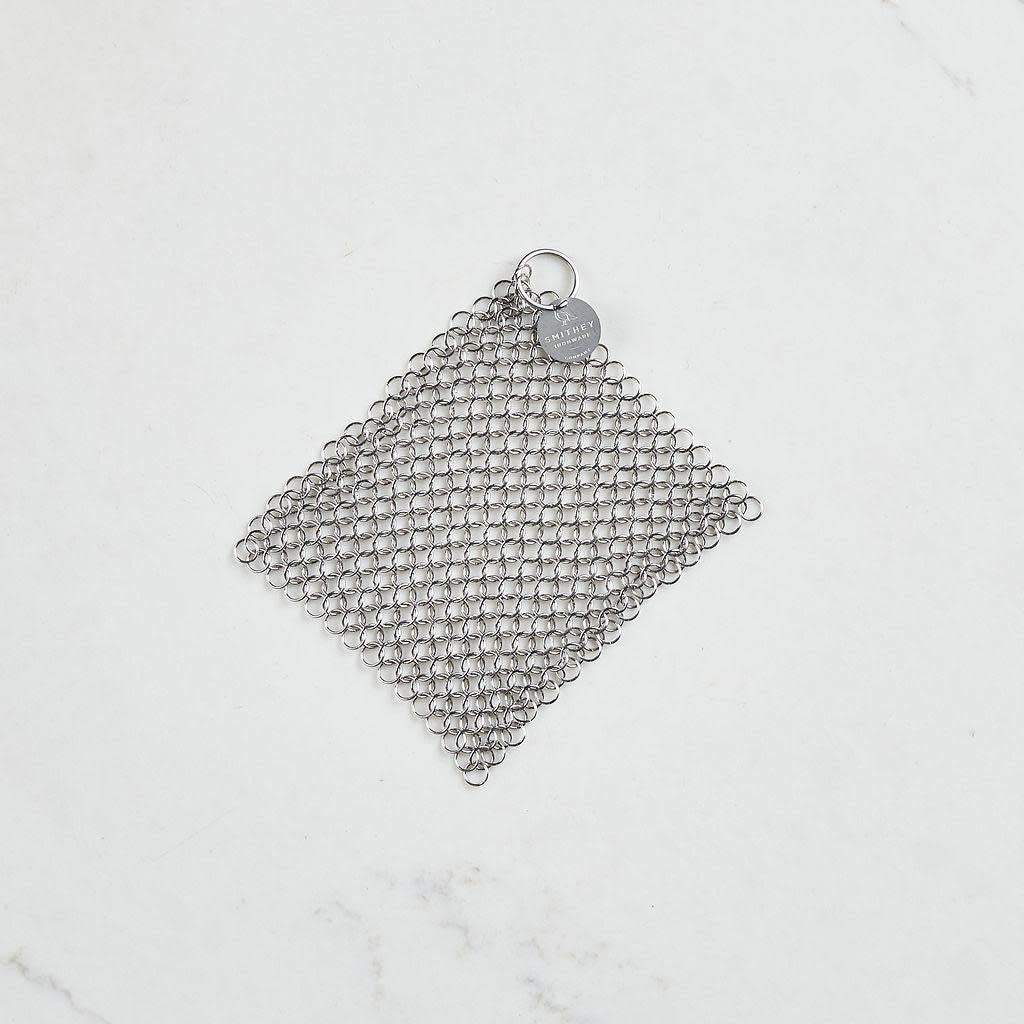 Stainless steel chainmail scrubber with logo on a white background