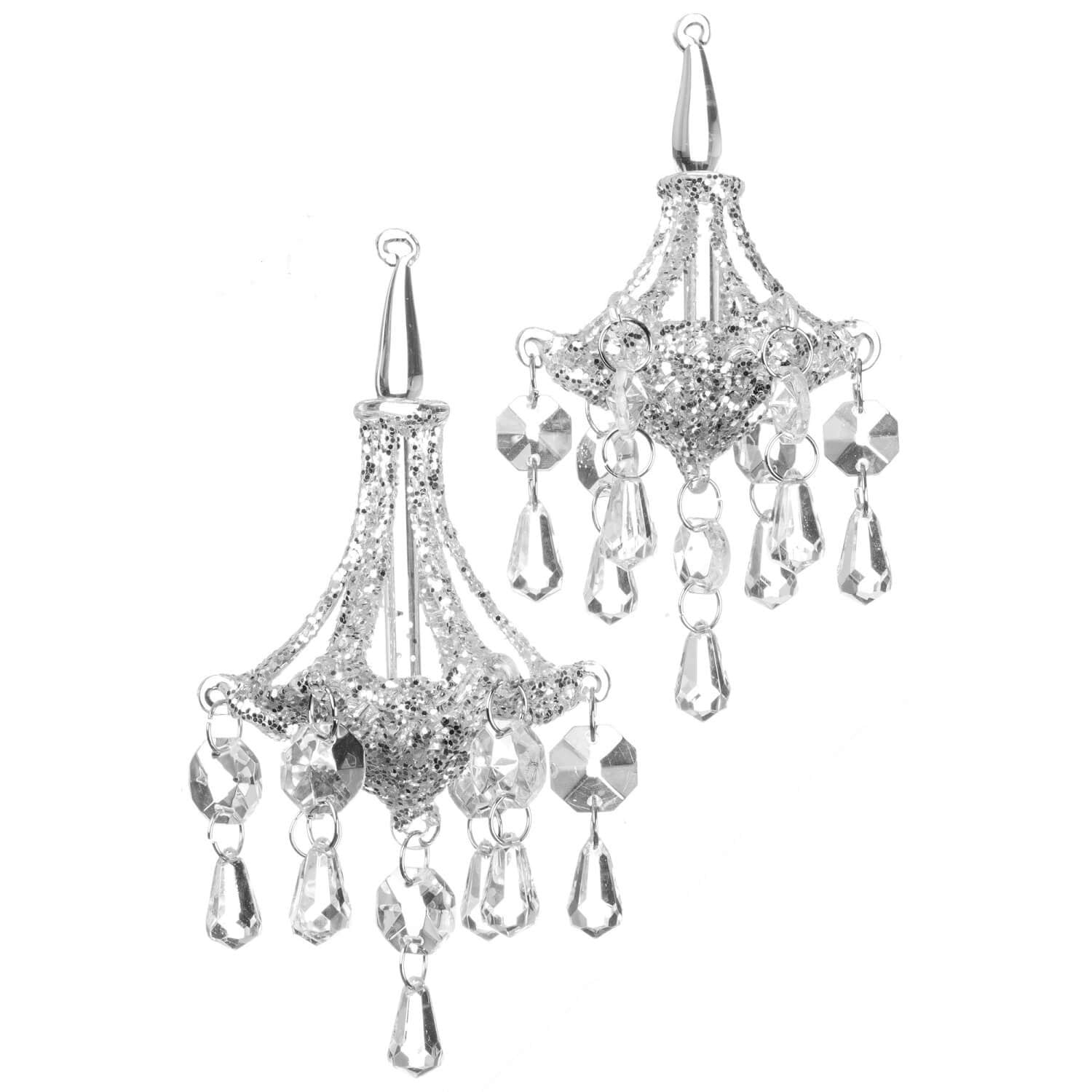 Clear glass faceted chandelier ornament with a tree branch silhouette.