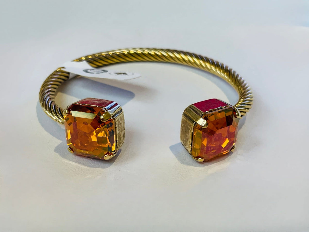 Gold plated brass square cuff bracelet featuring high quality crystals.