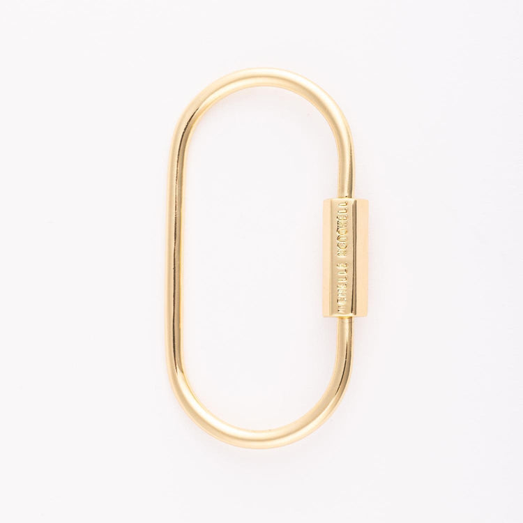 Gold-plated brass carabiner charm with a smooth oval loop.