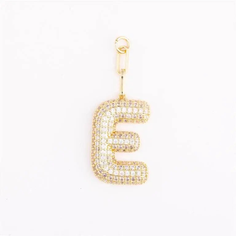 Heather-colored pave crystal charm bag accessory with gold plating and initial engraving.