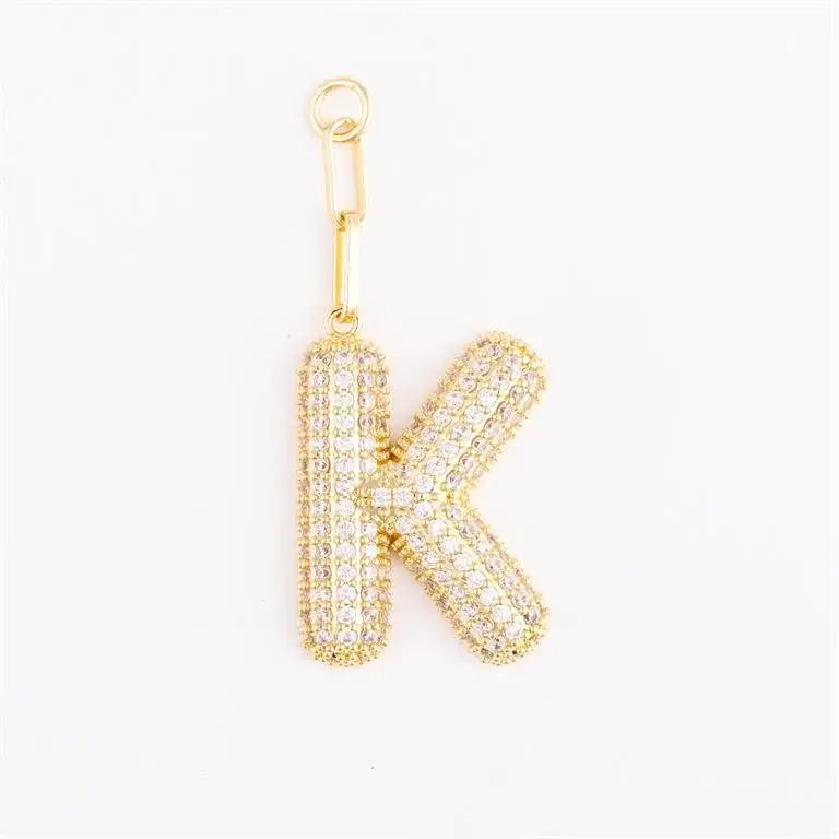 Heather-colored pave crystal charm bag pendant with initial engraving on gold-plated metal
