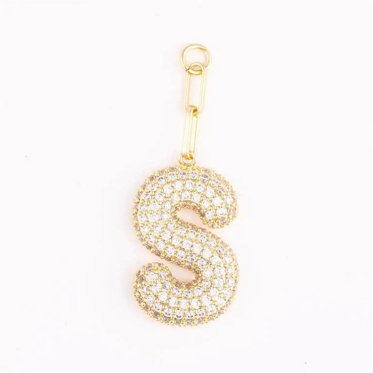 Heather-colored charm bag with pave crystal accents and gold plating featuring a customizable initial.