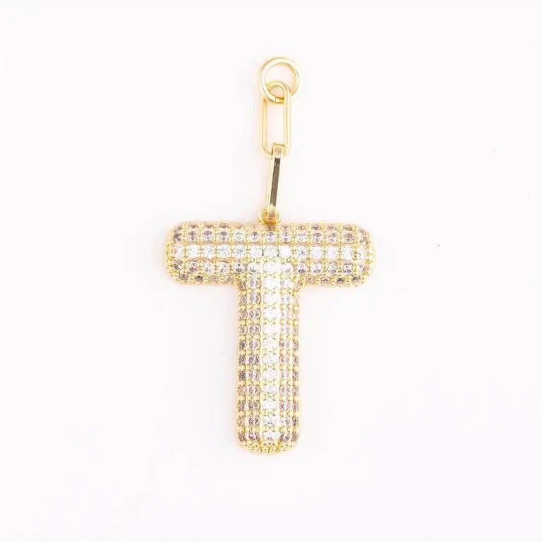 Heather-colored charm bag with pave crystal accents and initial engraving on gold-plated metal.