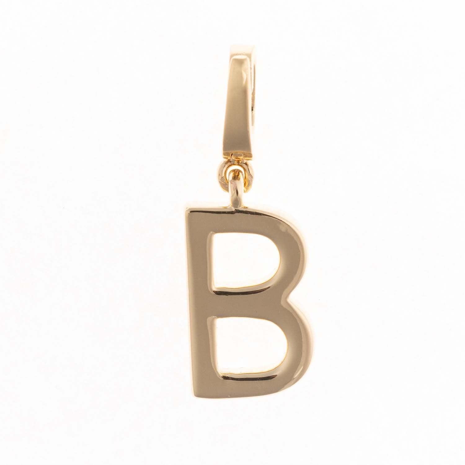 Gold-plated charm named Charm Tia with a small .5-inch length.