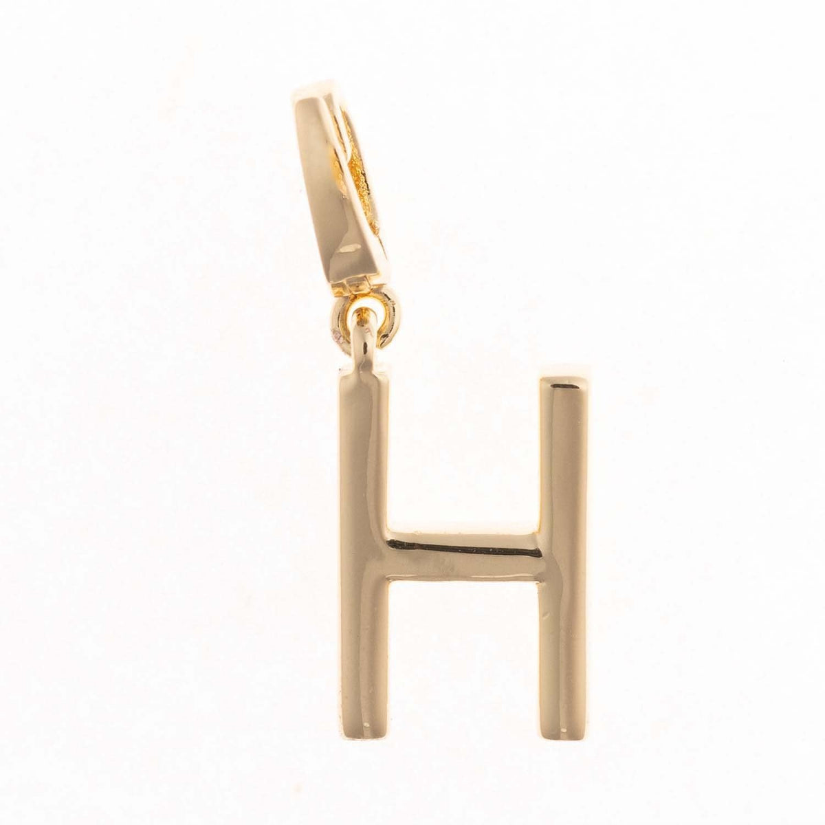 Gold-plated Charm Tia pendant with a .5-inch length featuring an intricate silhouette and nickel-free hypoallergenic material.