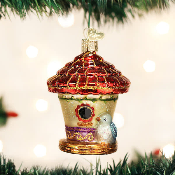Glassblower birdhouse ornament with natural wood finish and whistle flame detail