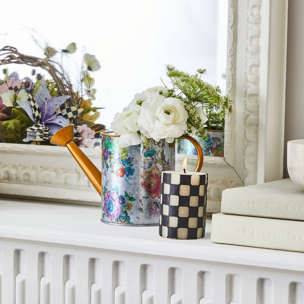 Four-inch black pillar candle made from a beeswax paraffin blend with a check pattern.