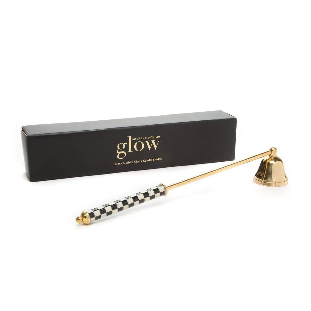 Brass candle snuffer with black steel handle featuring a white check pattern.