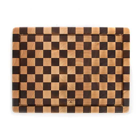 Handmade acacia wood check carving board with rubberwood accents.