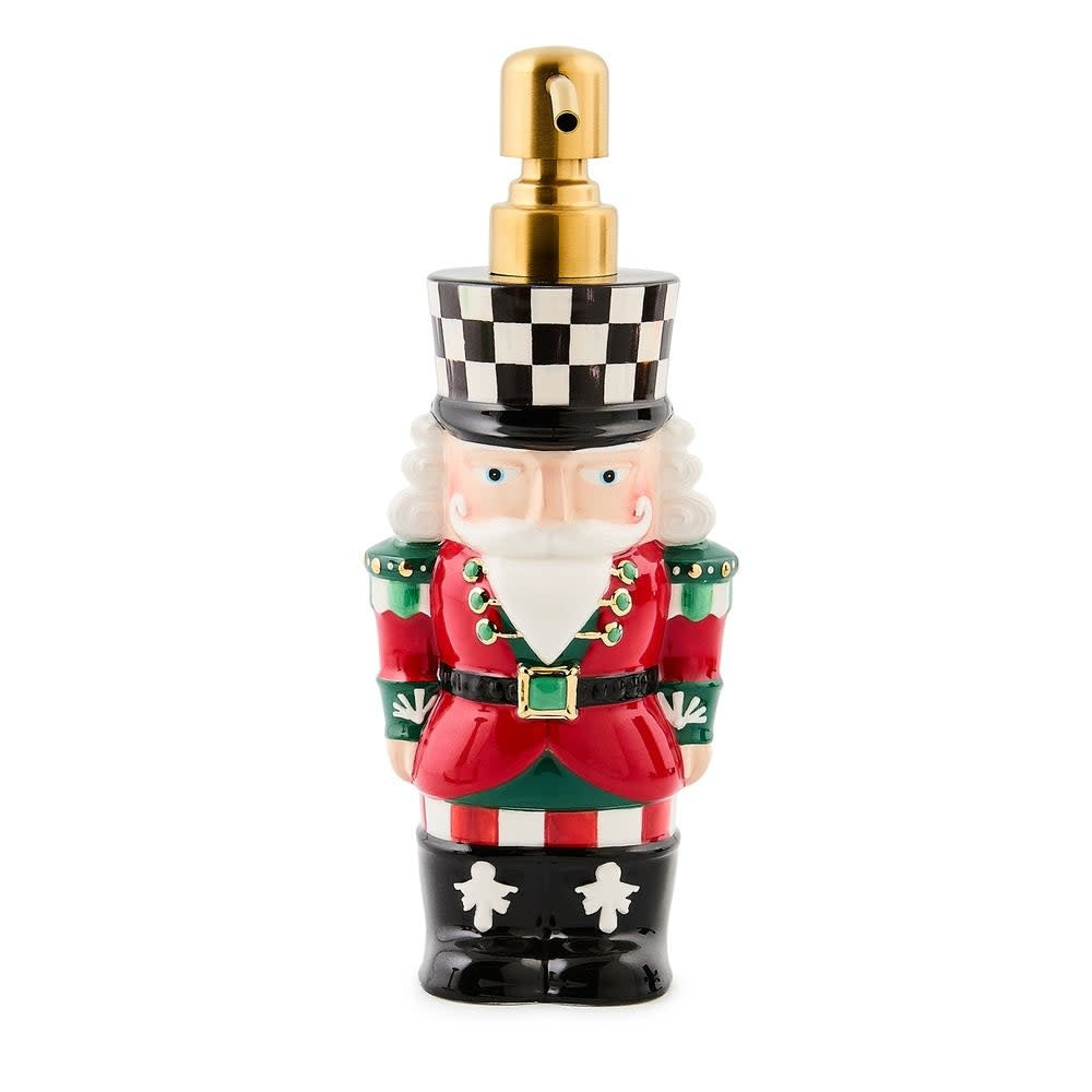 Ceramic nutcracker-shaped soap dispenser in festive red with gold trim.