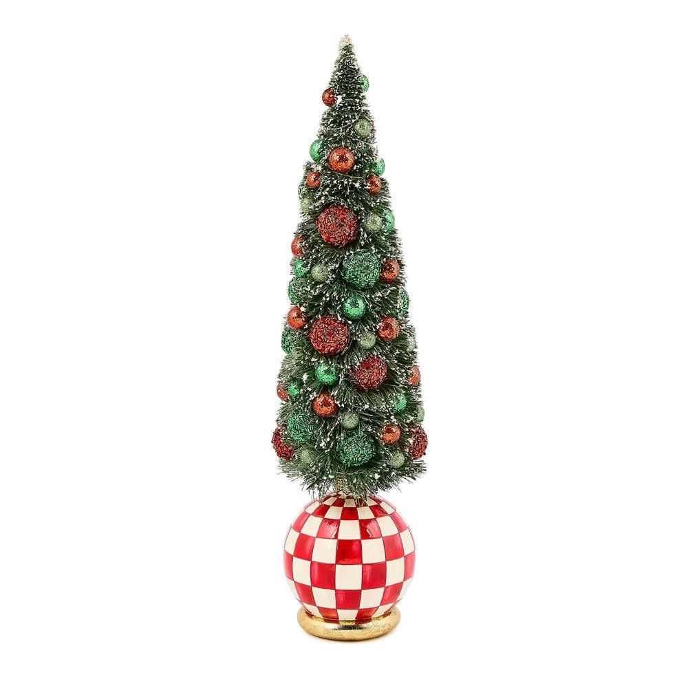 Illuminated bottle brush tree with frost-covered branches, red and green baubles on a resin base.