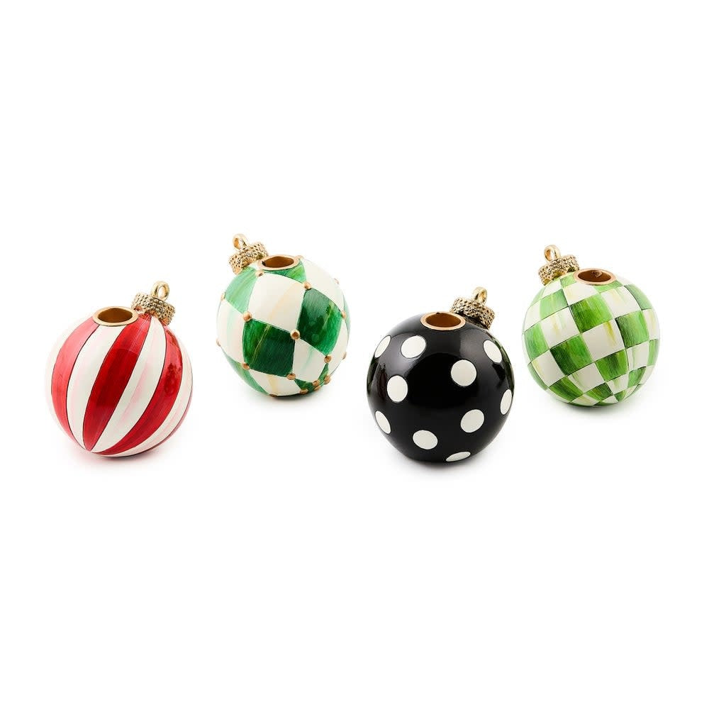 Resin candle holder shaped like a checkered ornament with red and white stripes.