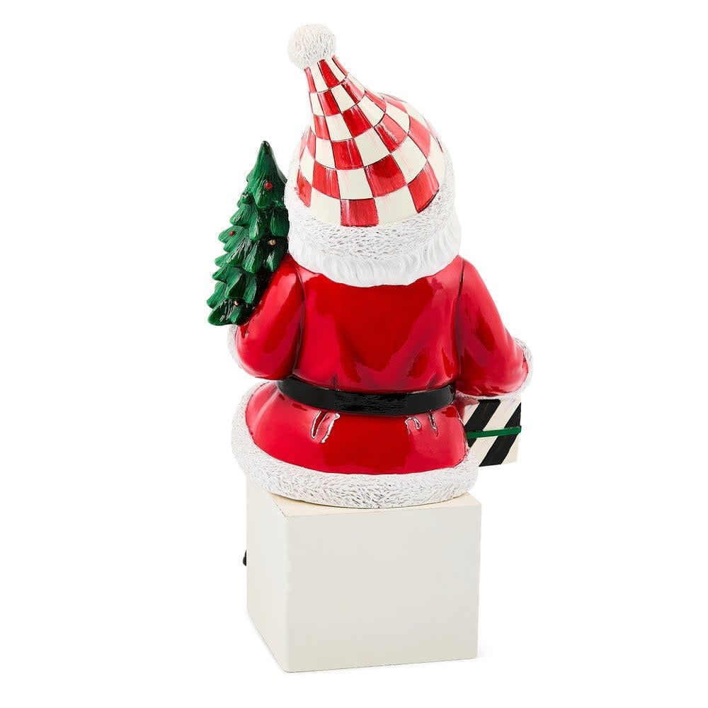 Resin Santa Claus ledge sitter figurine in red suit with white beard holding a small tree.
