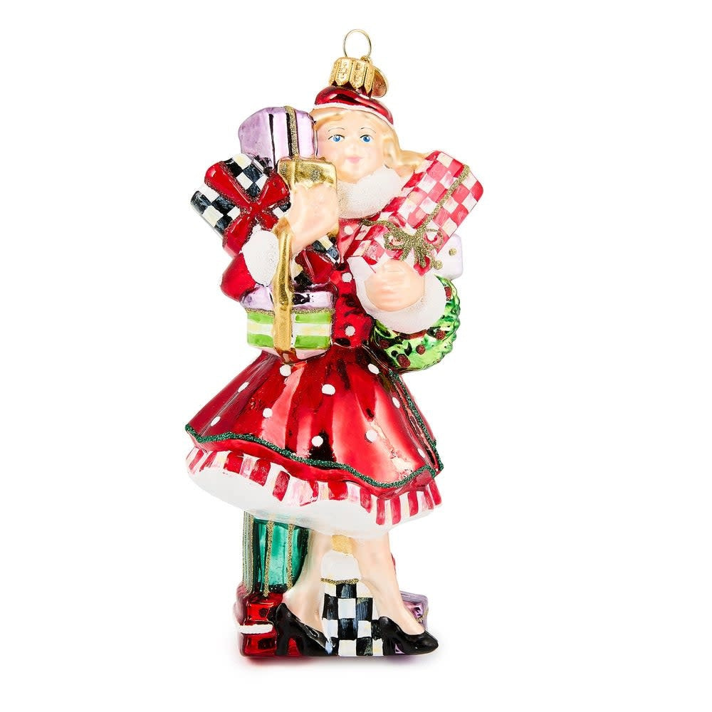 Hand-painted glass ornament shaped like a shopper with brass logo charm