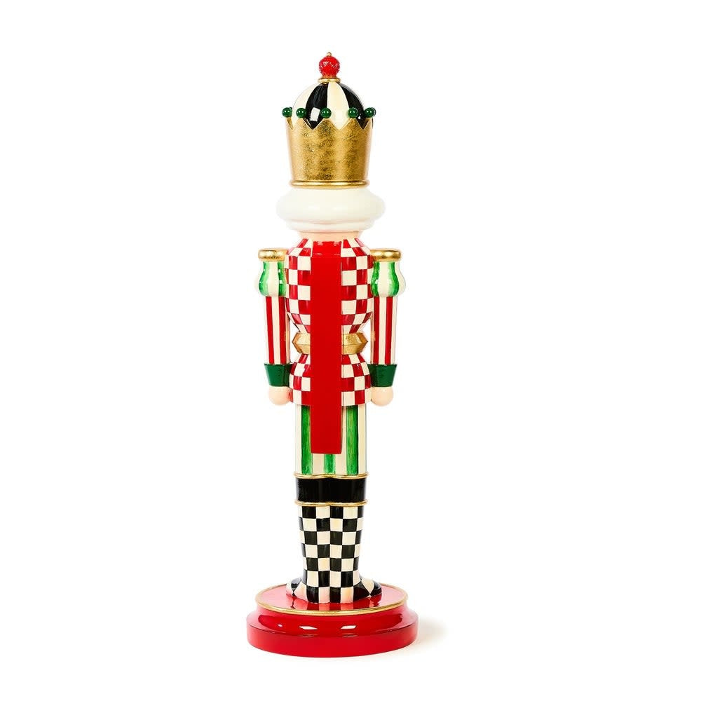 Small resin nutcracker with Courtly check patterns, green stripes, red accents, and a crown topped by an iconic thistle logo.