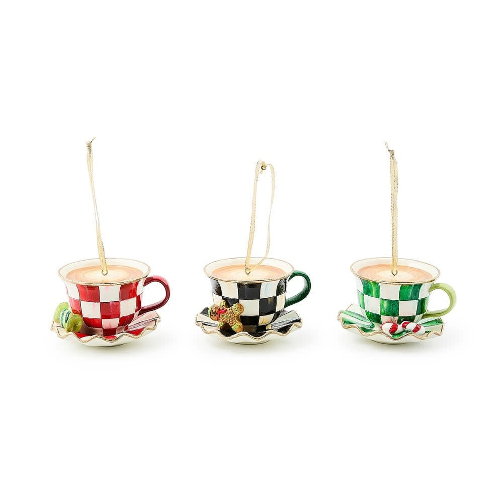 Handmade resin teacup ornament with a festive checkered pattern in red, white, and green.