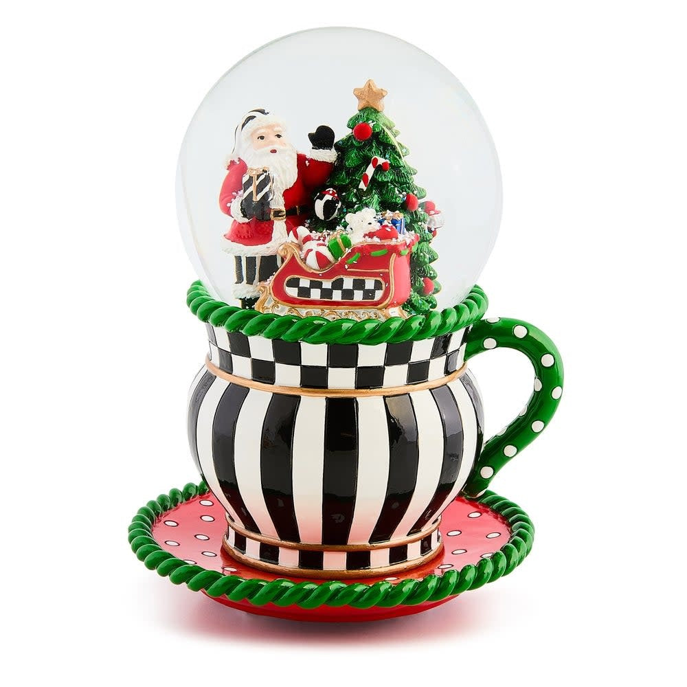 Resin teacup snow globe with glass dome featuring winter scene inside.