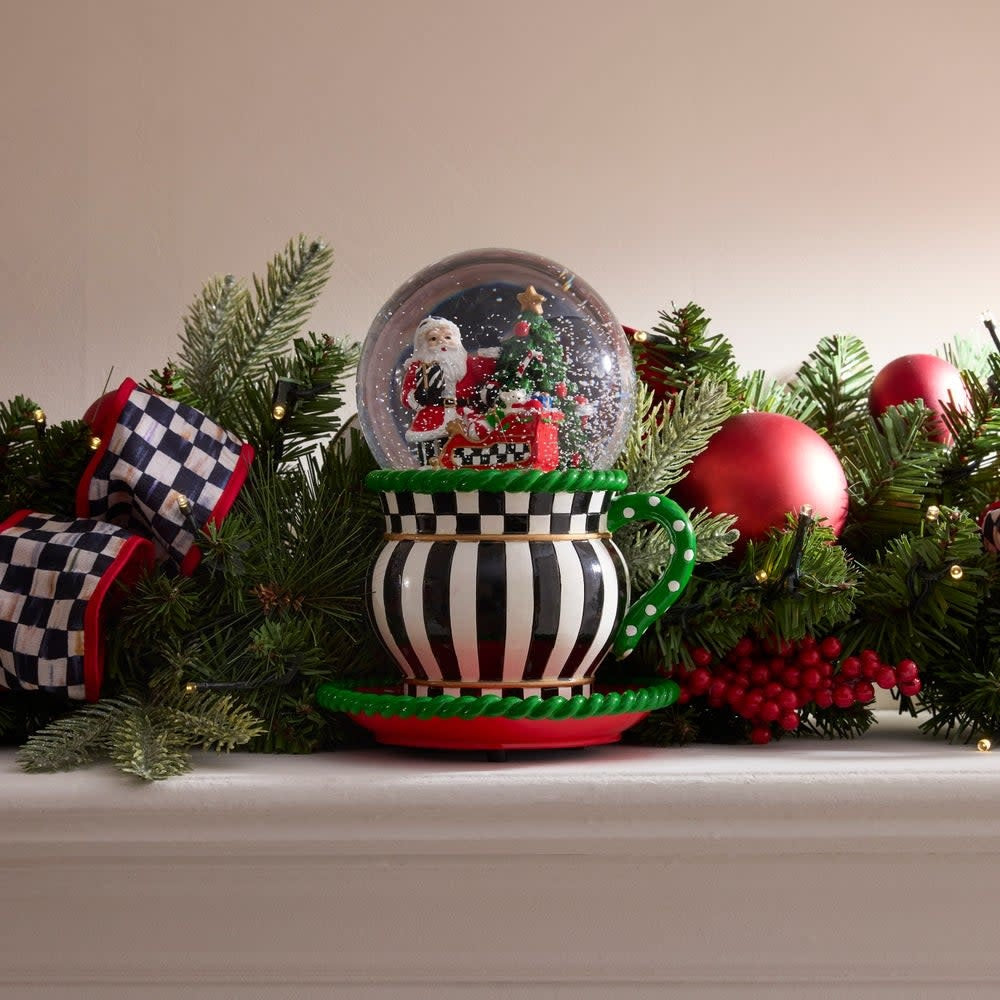 Resin teacup snow globe with glass lid featuring a winter scene inside.