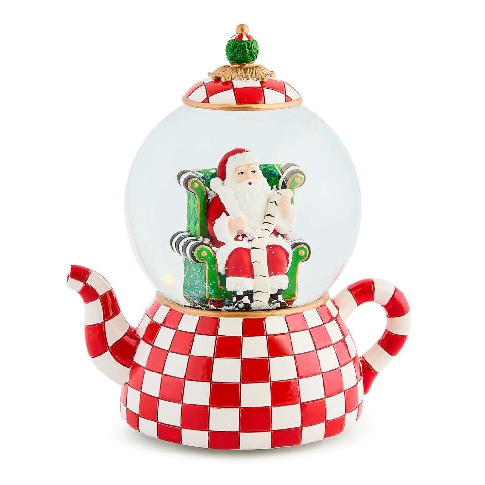 Resin teapot snow globe with glass dome featuring winter scene inside.