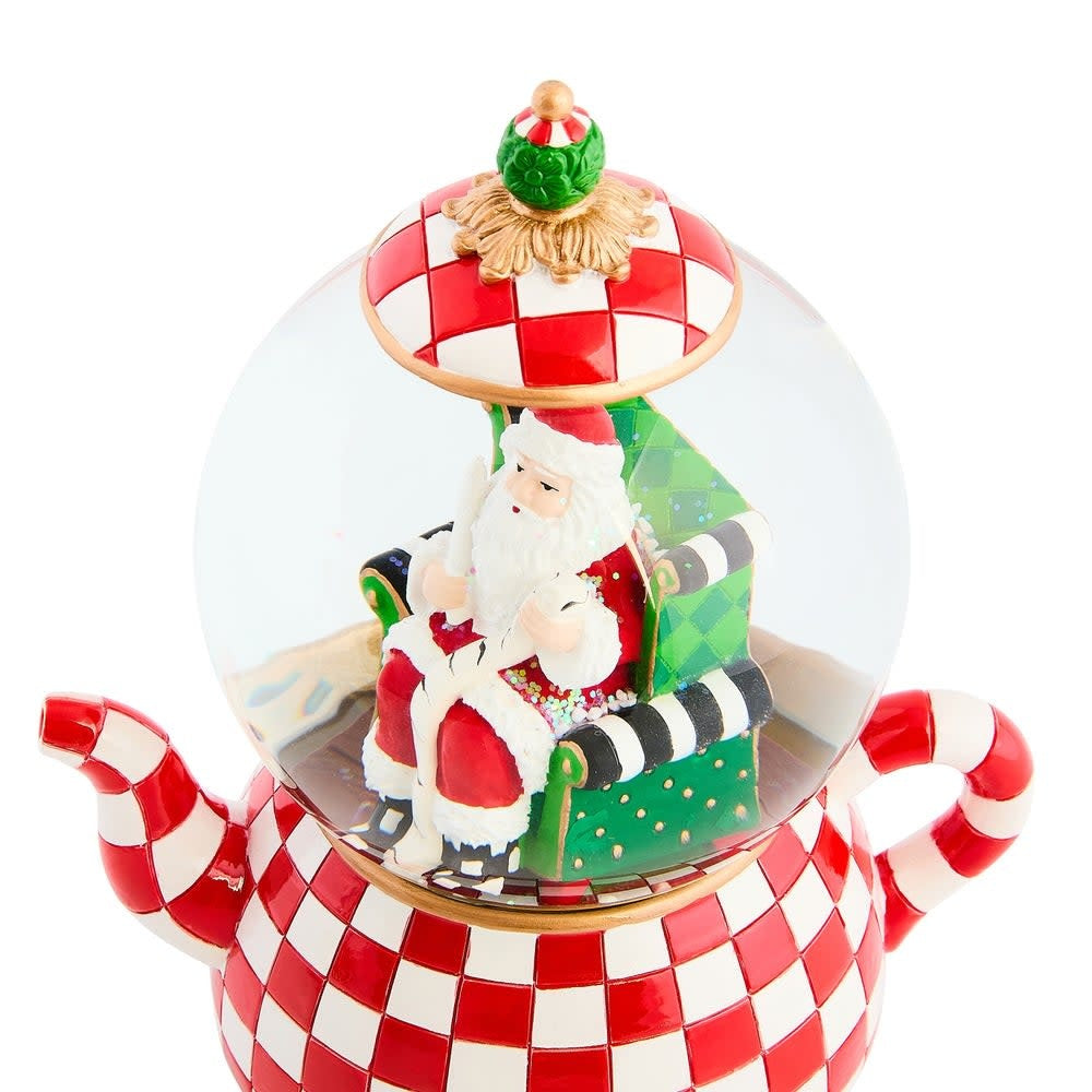 Resin teapot snow globe with glass dome featuring winter scene inside.