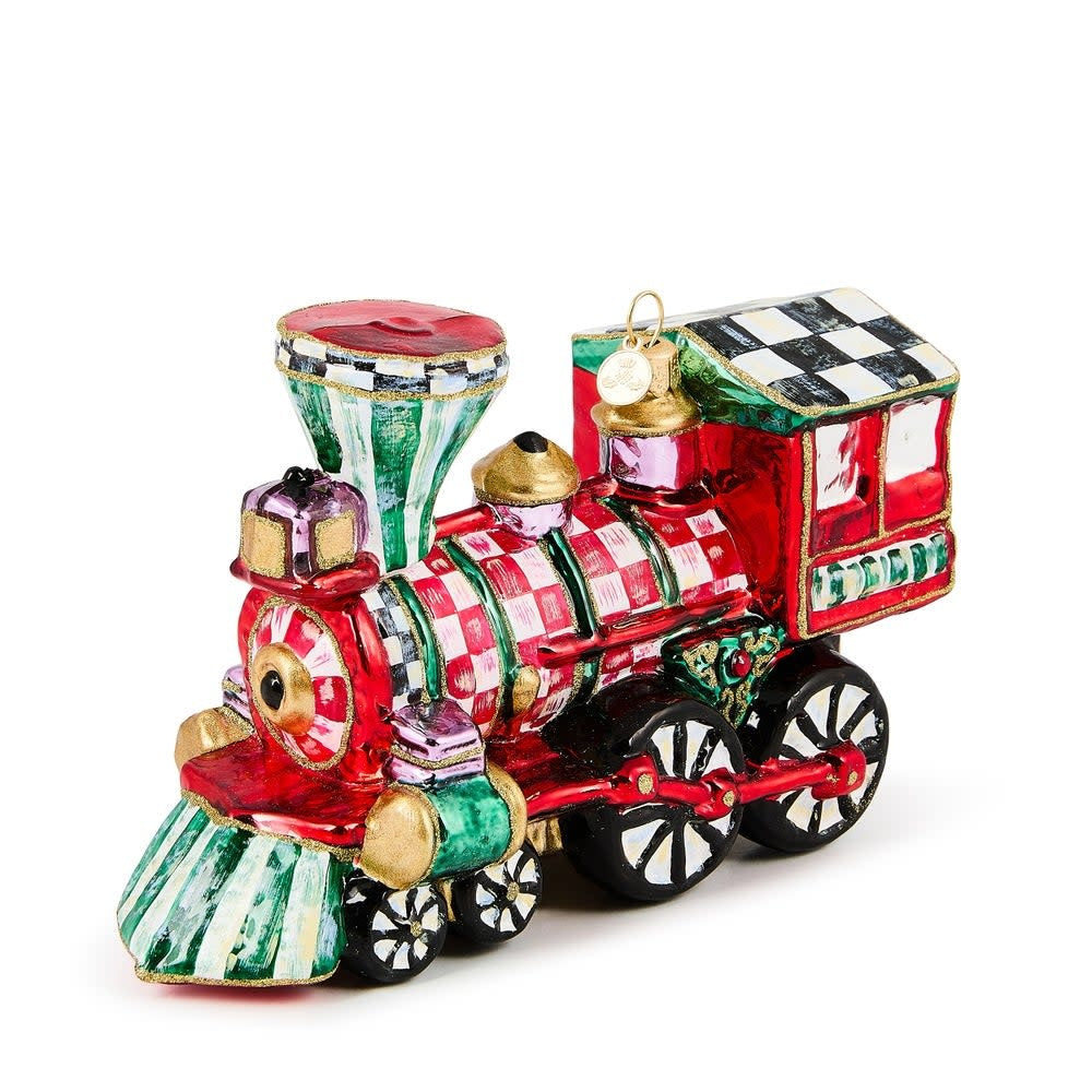 Hand-painted glass train ornament with brass logo charm holding holiday gifts