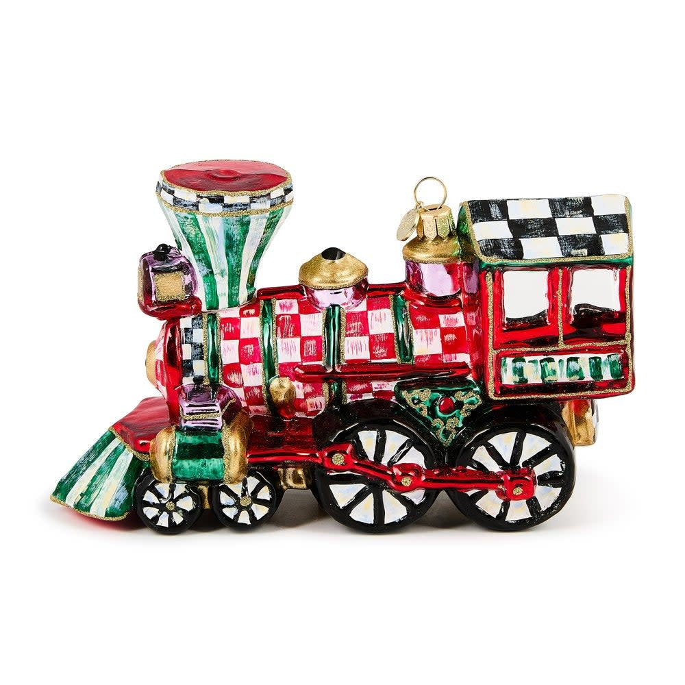 Hand-painted glass train ornament with brass logo charm holding holiday gifts