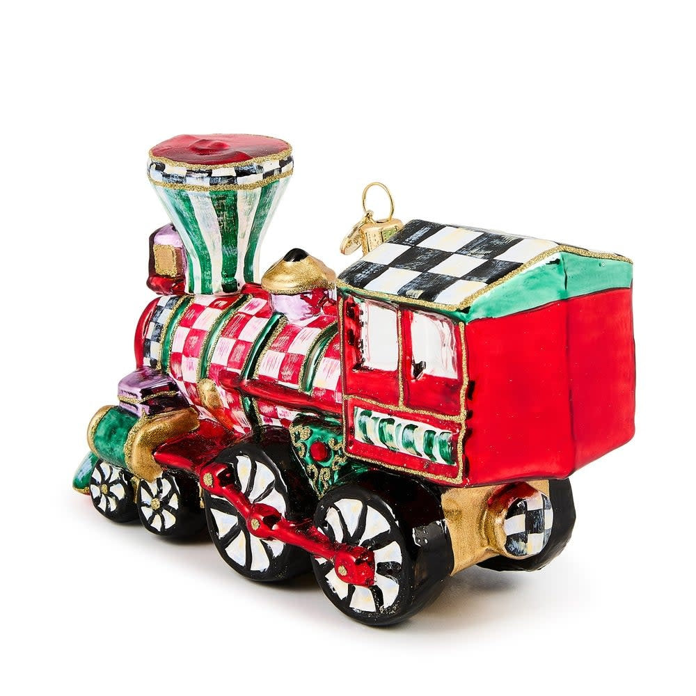 Hand-painted glass train ornament with brass logo charm holding holiday gifts