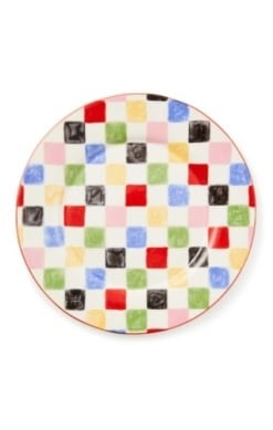 Round stoneware platter with a black checkered pattern on white background.