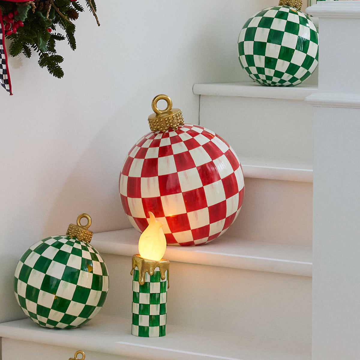 Oversized resin tabletop ornament with watercolor-style red check pattern on a gold foil cap.