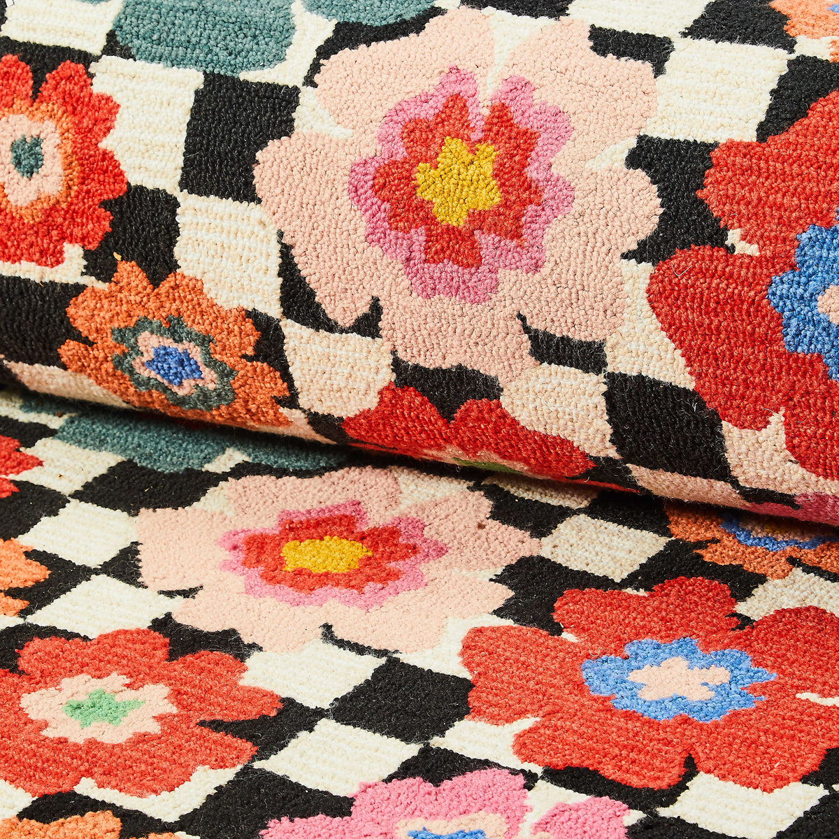 Woven polyester indoor/outdoor rug with floral check pattern in neutral tones
