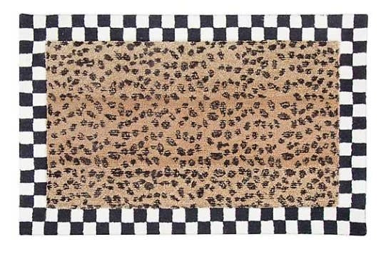 Handmade cheetah print area rug with wool and rayon blend in a rectangular silhouette.