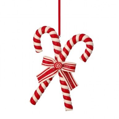 Two red and white striped clay dough candy canes tied with a matching bow Christmas ornament.