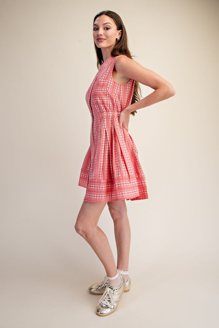 Sleeveless pink Clara Boho shirt dress with white embroidery, V-neck, and pleated fit & flare skirt.