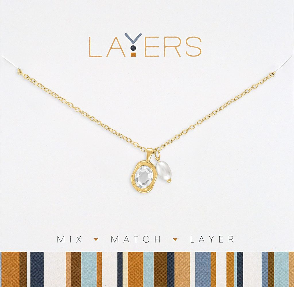 Gold chain necklace with an oval crystal pendant and a small white pearl charm.