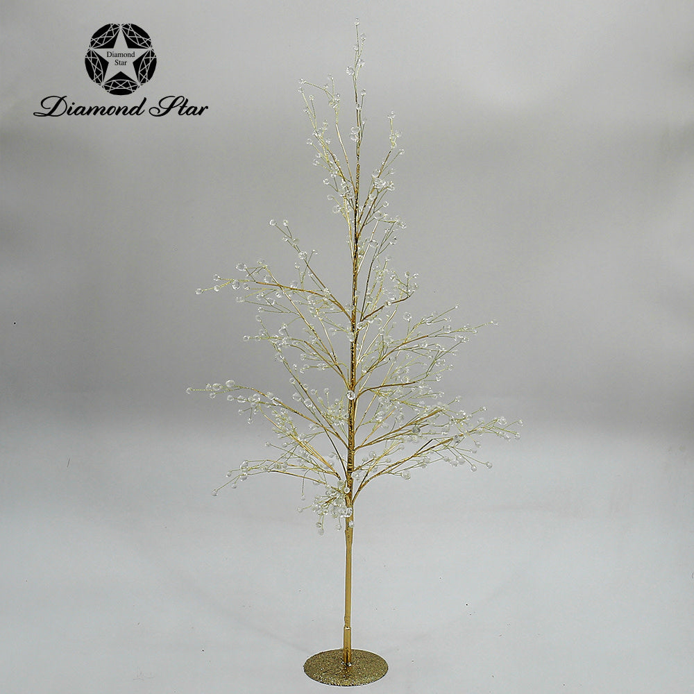 Gold decorative Christmas tree with crystal accents on a glittery base