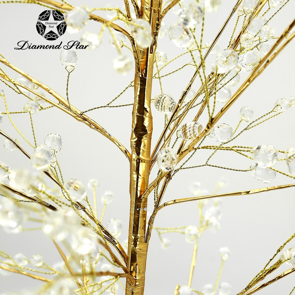 Gold decorative tree with shimmering branches, crystal accents, glittery base, and L35.4 inch height.