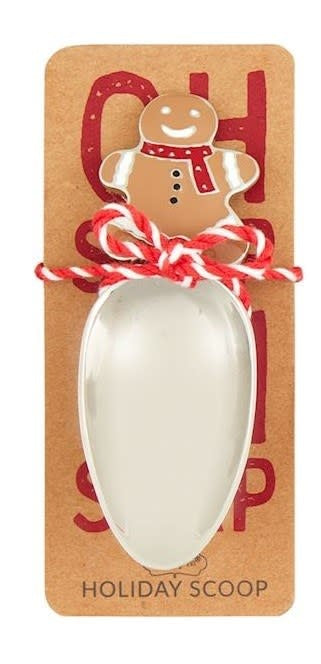Metal candy scoop with Christmas character handle in wooden crate