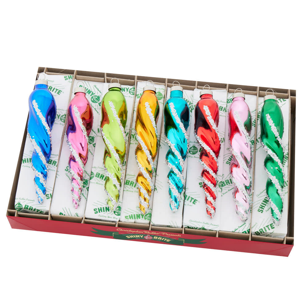 Eight glass Christmas icicles with confetti patterns in vibrant festive hues.
