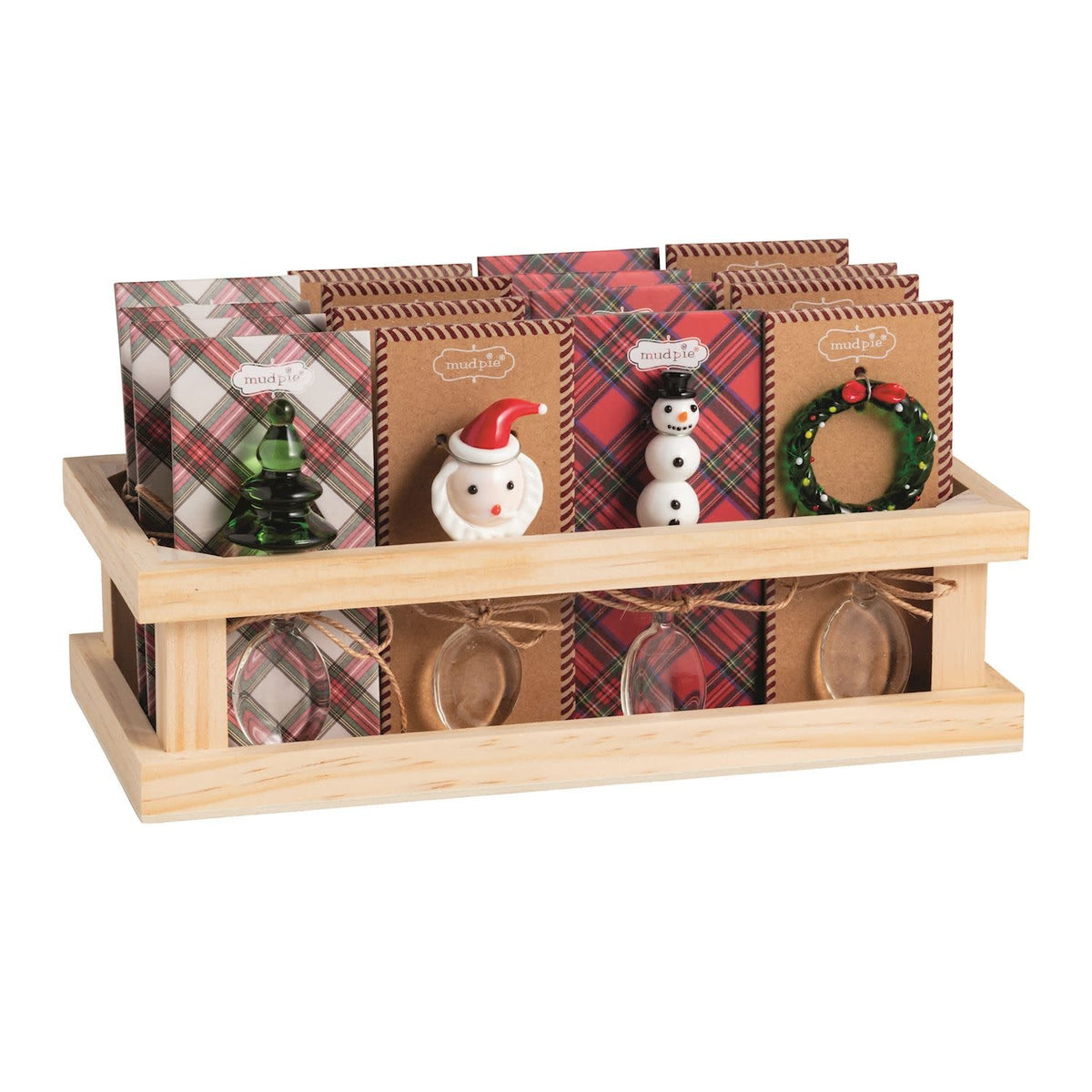 Glass candy scoop with figural handle featuring a Christmas tree shape on display card.