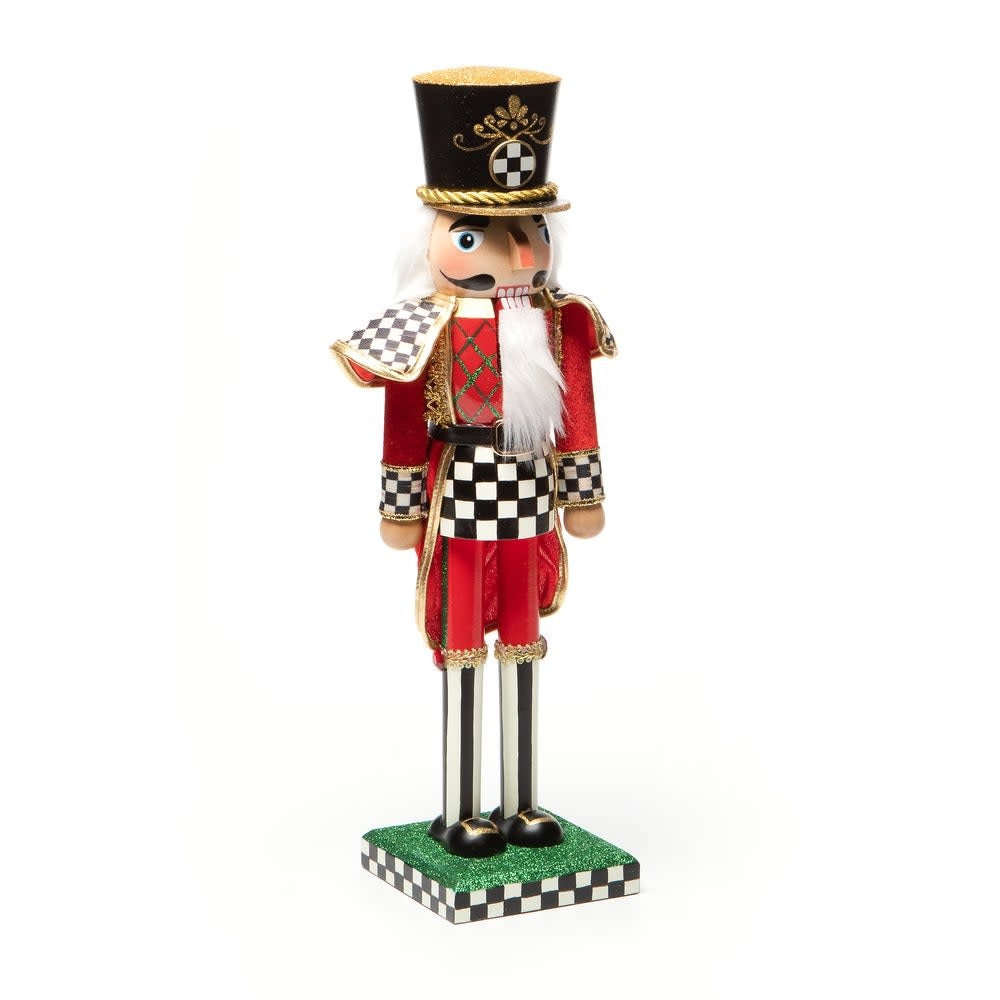 Hand-painted wooden Christmas nutcracker soldier in red uniform with gold trim standing on a black base.