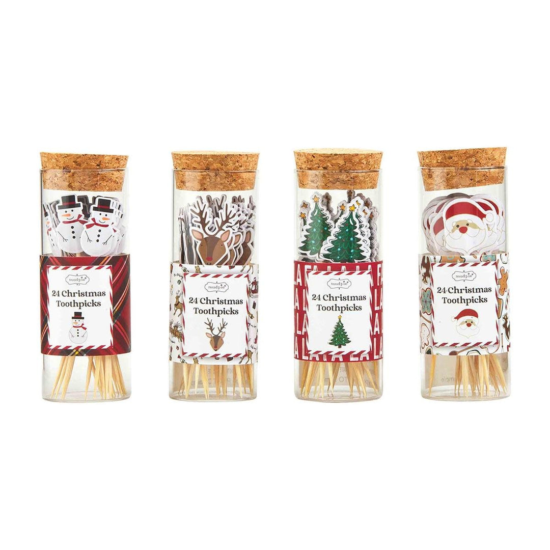 Red paper Christmas toothpick with white snowflake pattern on a green background.