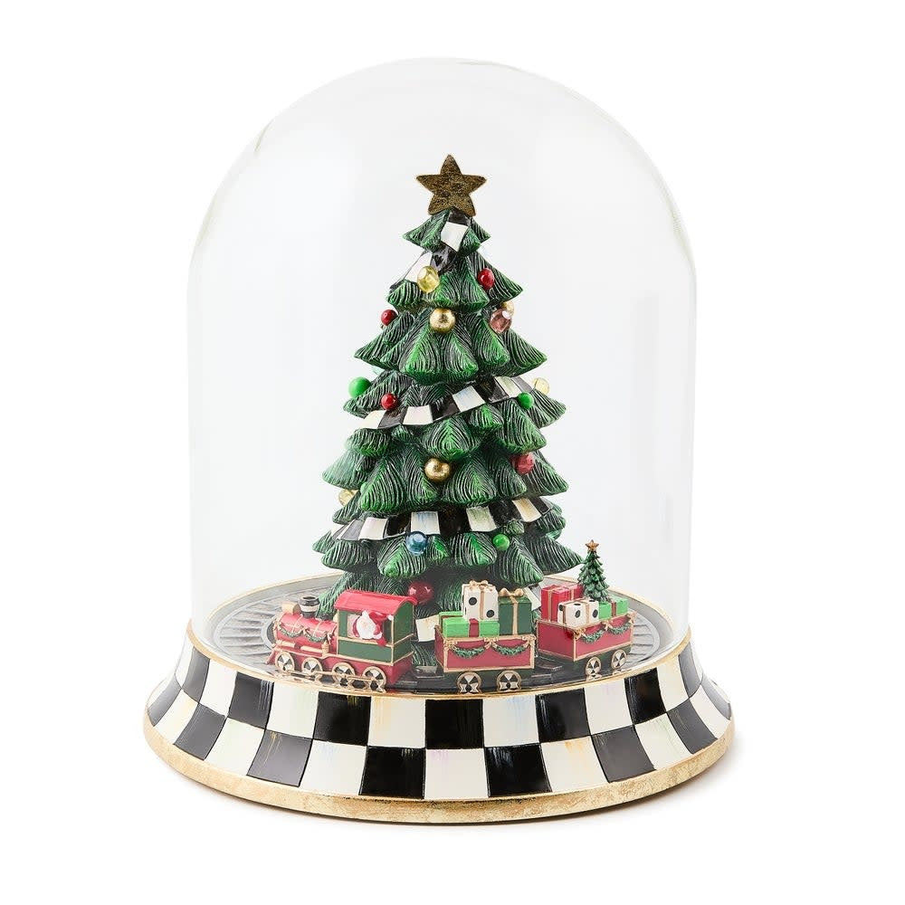 Resin Christmas tree train music box cloche featuring a decorated tree with circling trains in red and green tones.