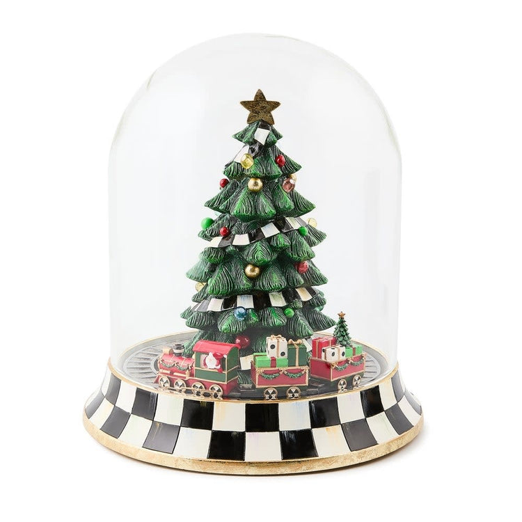Resin Christmas tree train music box cloche featuring a decorated tree with circling trains in red and green tones.