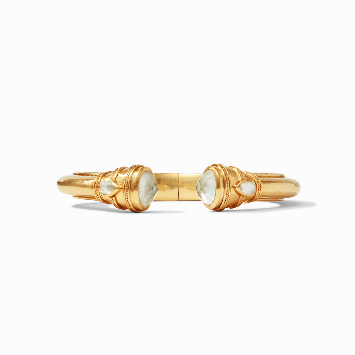 Cannes Demi Cuff in gold with shell pearl endcaps and pear-shaped gemstones.