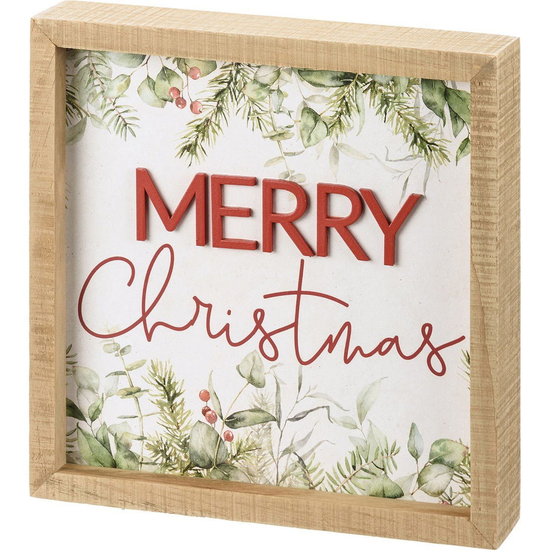 Inset wooden box sign with a Merry Christmas message in red lettering on white paper.